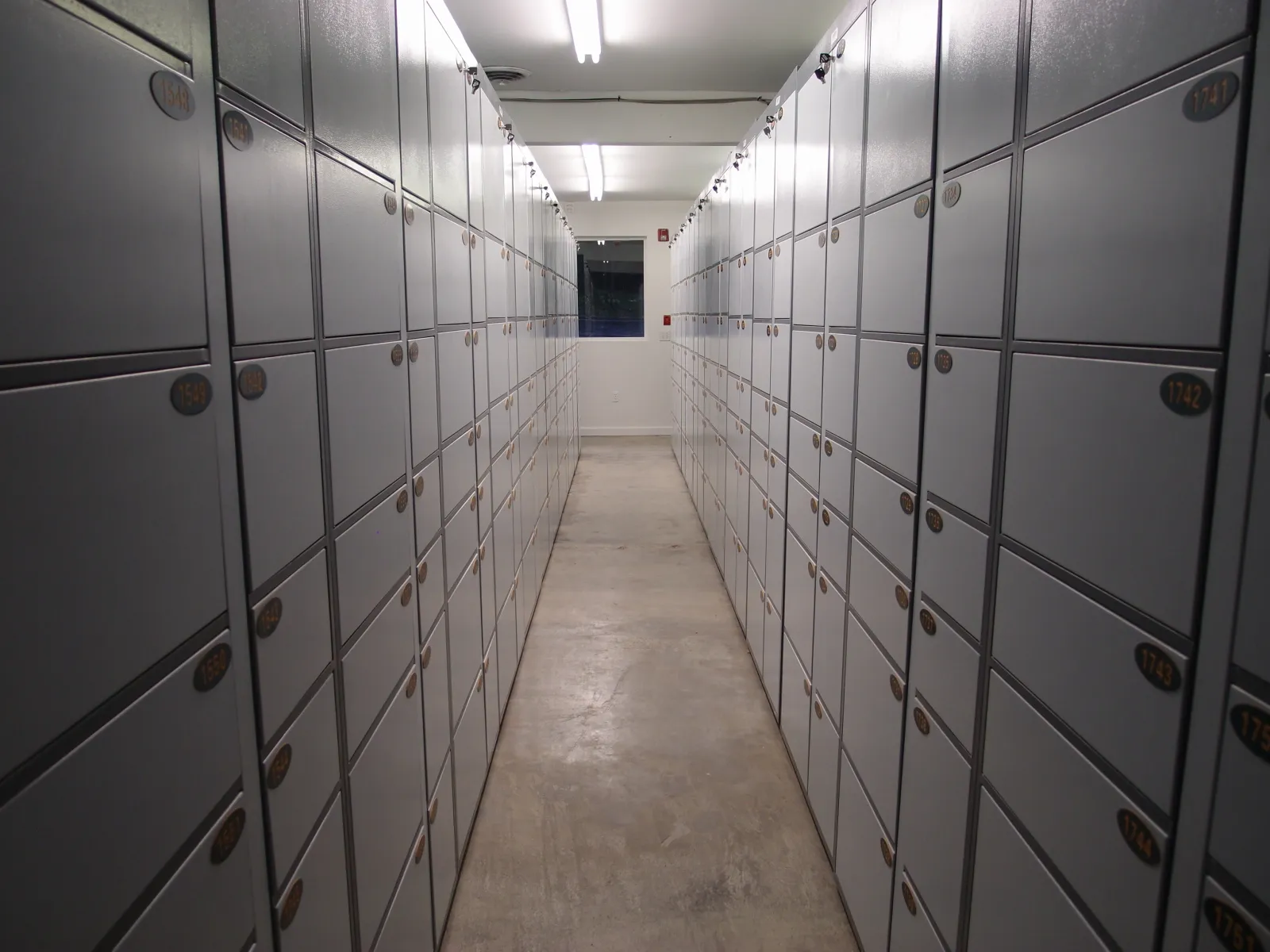 Aisle of numbered self-serve parcel lockers at In Out Parcel in Point Roberts, WA